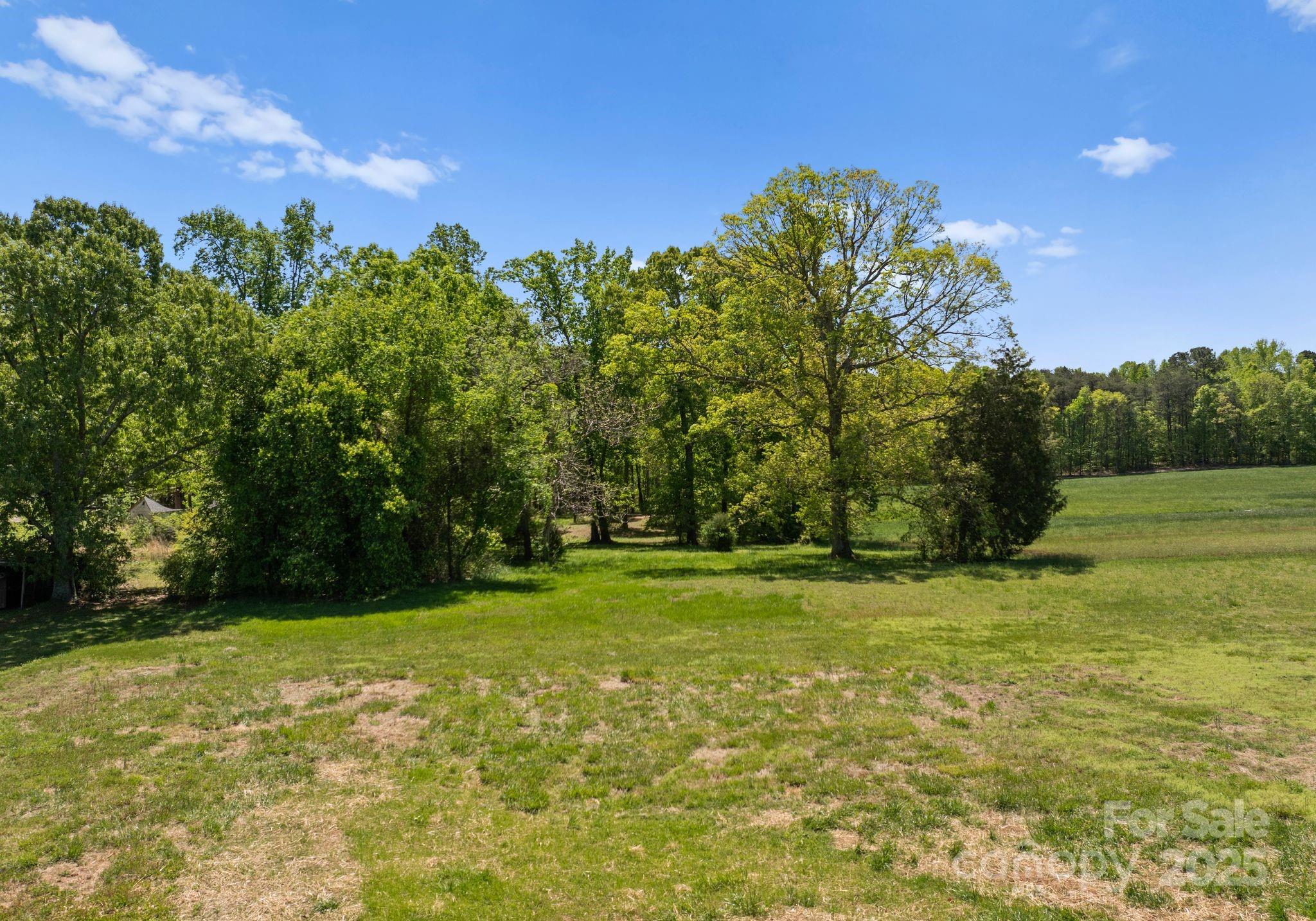 155 Jackson Road Salisbury, NC 28146 - Photo 25 of 26 a view of a field with trees in the background