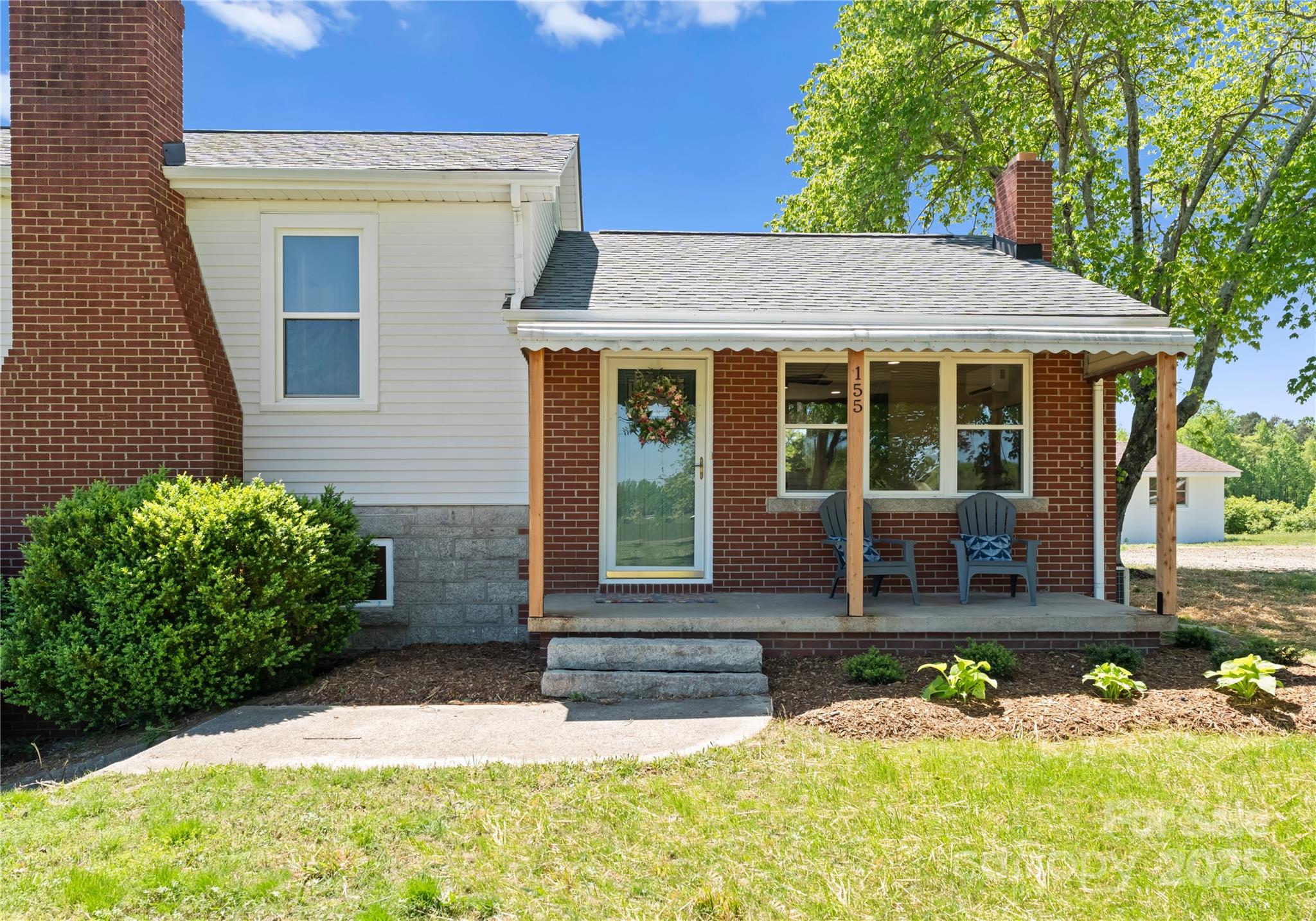155 Jackson Road Salisbury, NC 28146 - Photo 4 of 26 a front view of a house with a yard