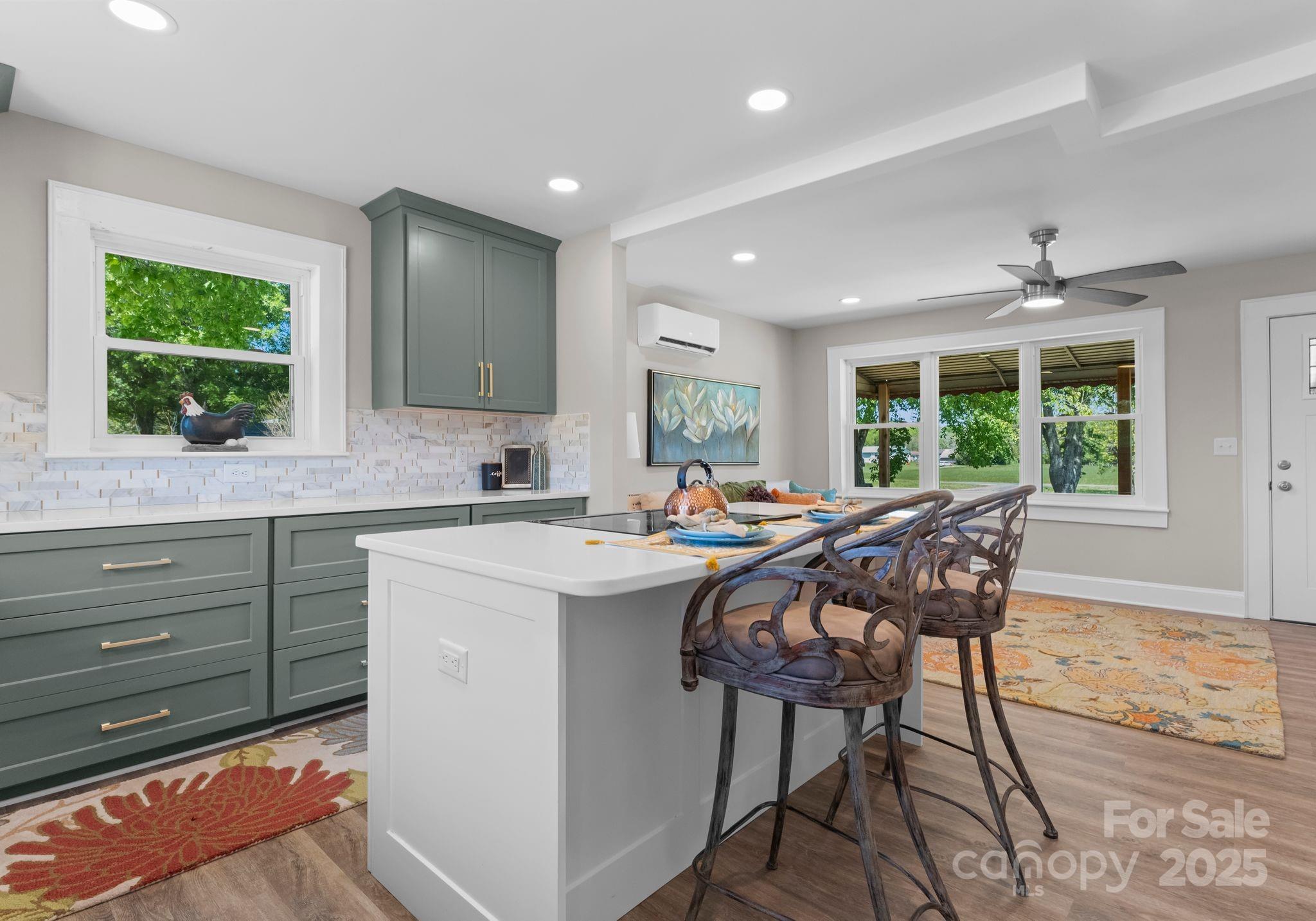 155 Jackson Road Salisbury, NC 28146 - Photo 9 of 26 a kitchen with a table chairs sink and cabinets