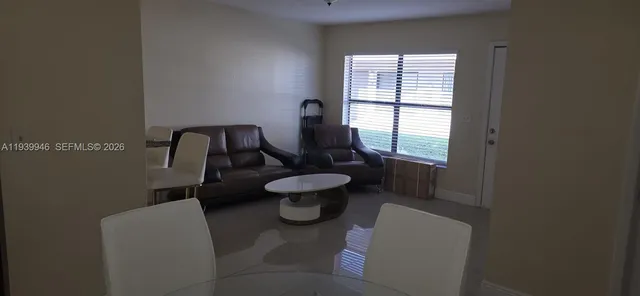 a bathroom with a toilet sink and window