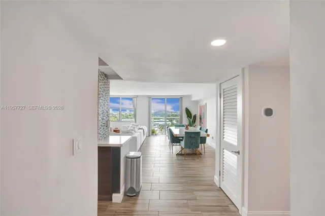 a view of a living room with furniture and a window