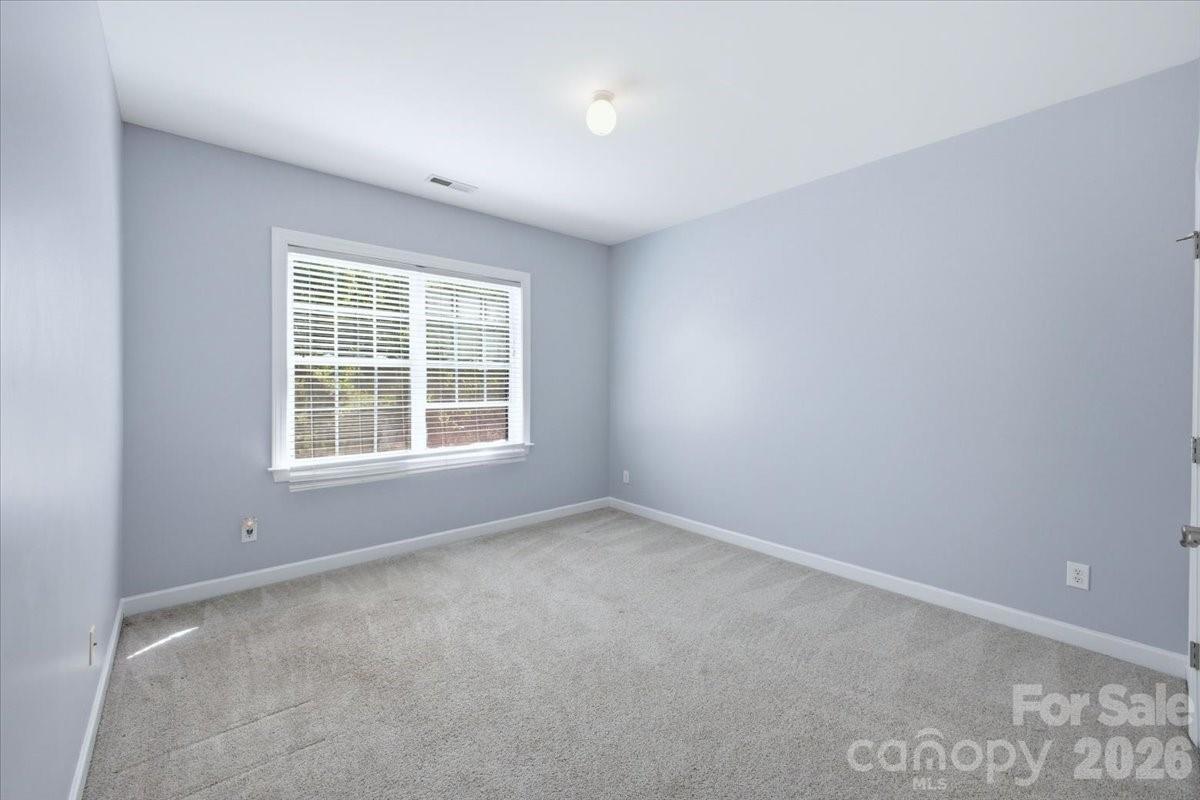 1825 Laveta Road Charlotte, NC 28269 - Photo 30 of 48 an empty room with windows