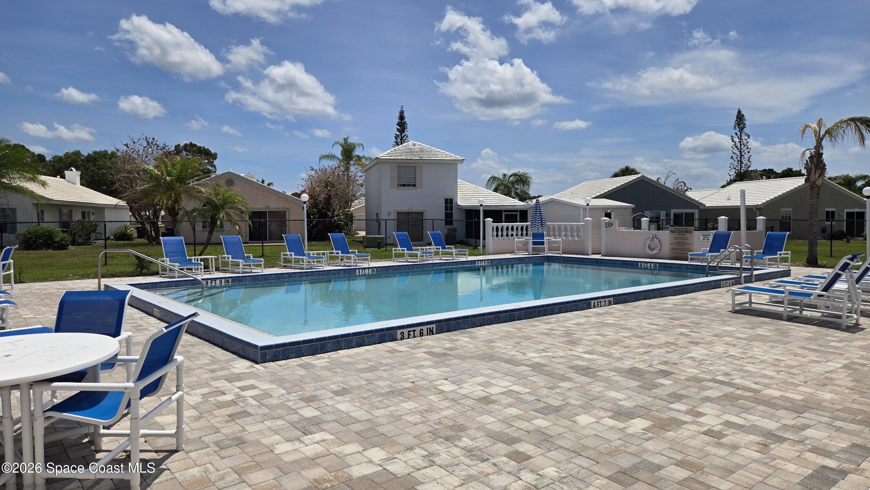 1977 Myrtle Court Palm Bay, FL 32905 - Photo 19 of 19 a swimming pool with outdoor seating and yard