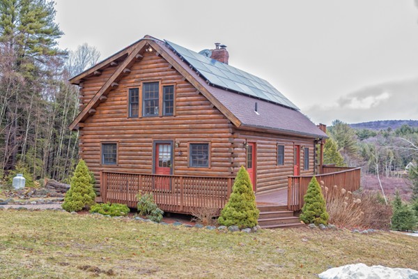 1403 Burt Hill Road Tolland, MA 01034 - Photo 1 of 30 a front view of a house with a yard