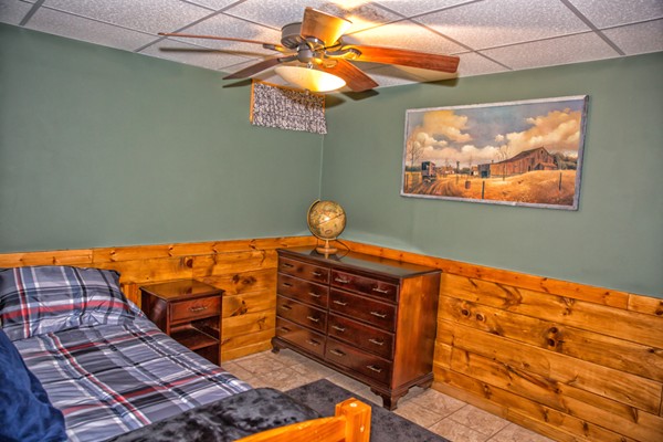 1403 Burt Hill Road Tolland, MA 01034 - Photo 23 of 30 a bed room with a bed and a painting on the wall