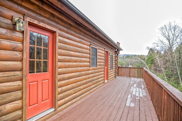 1403 Burt Hill Road Tolland, MA 01034 - Photo 25 of 30 a view of balcony with wooden floor and fence