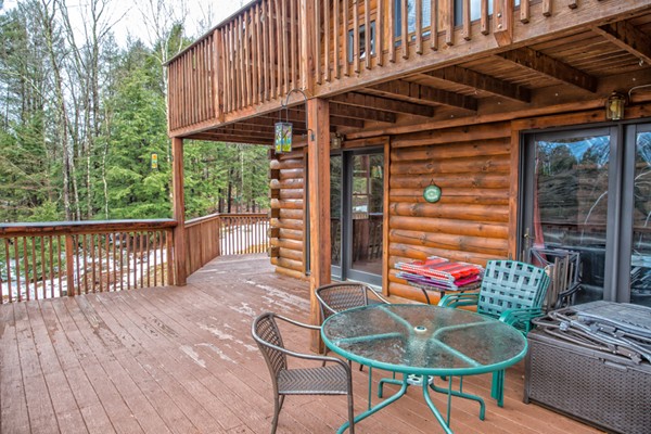 1403 Burt Hill Road Tolland, MA 01034 - Photo 28 of 30 a balcony with furniture and a potted plant