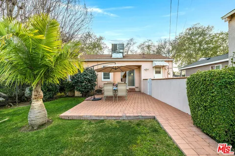 a view of a house with a yard porch and sitting area