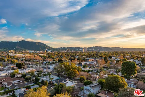 a view of a city with mountains in the background