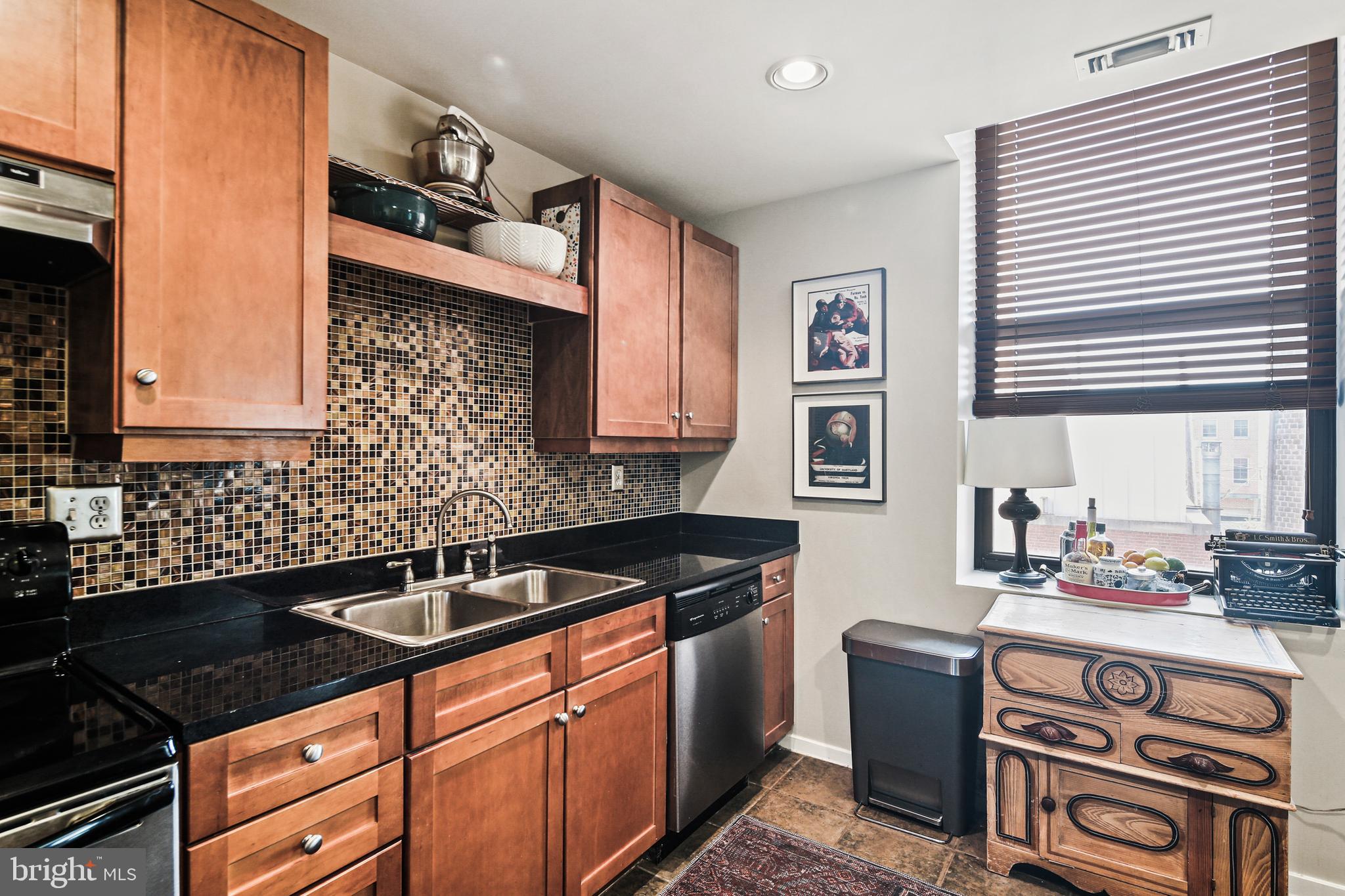 1211 Light Street, Unit 308 Baltimore, MD 21230 - Photo 14 of 29 a kitchen with stainless steel appliances granite countertop a sink stove and cabinets