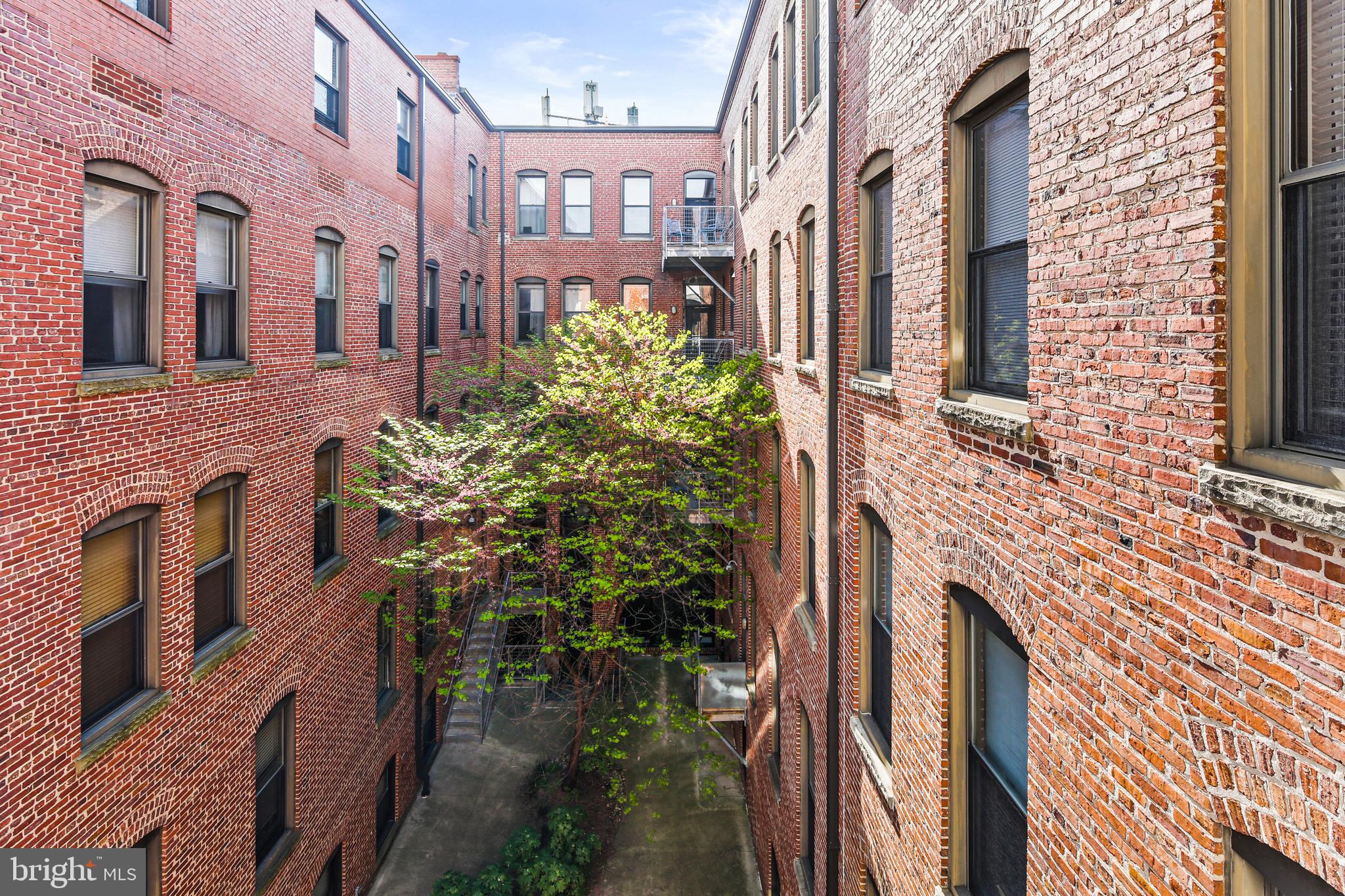 1211 Light Street, Unit 308 Baltimore, MD 21230 - Photo 17 of 29 a view of a brick buidling front with many windows