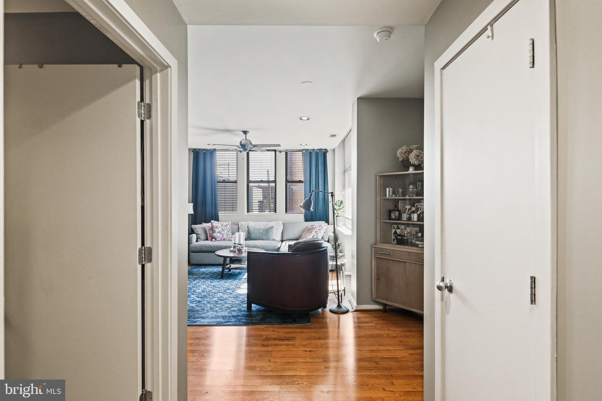 1211 Light Street, Unit 308 Baltimore, MD 21230 - Photo 18 of 29 a living room with furniture and a wooden floor