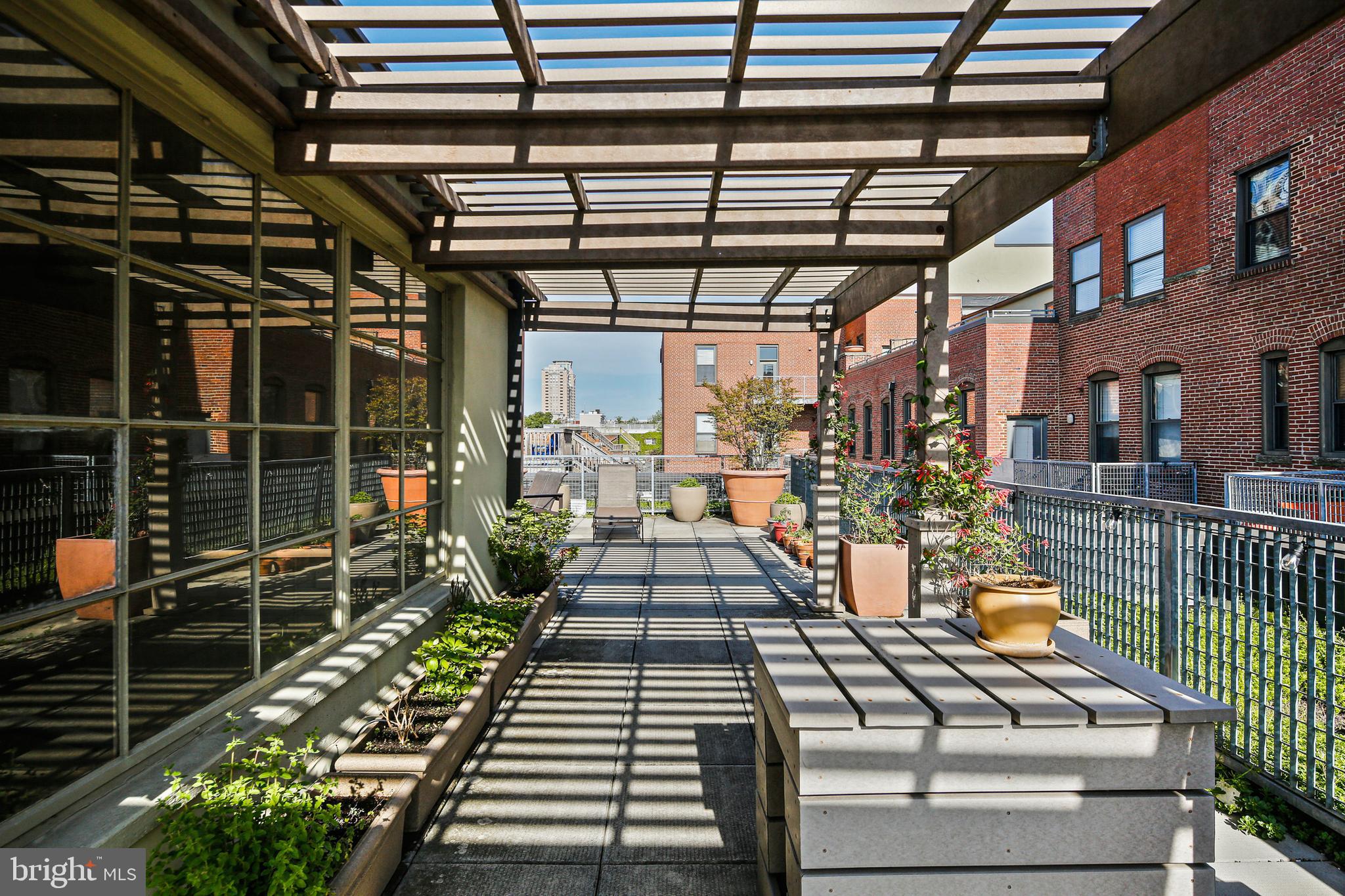 1211 Light Street, Unit 308 Baltimore, MD 21230 - Photo 22 of 29 a view of a balcony with wooden floor