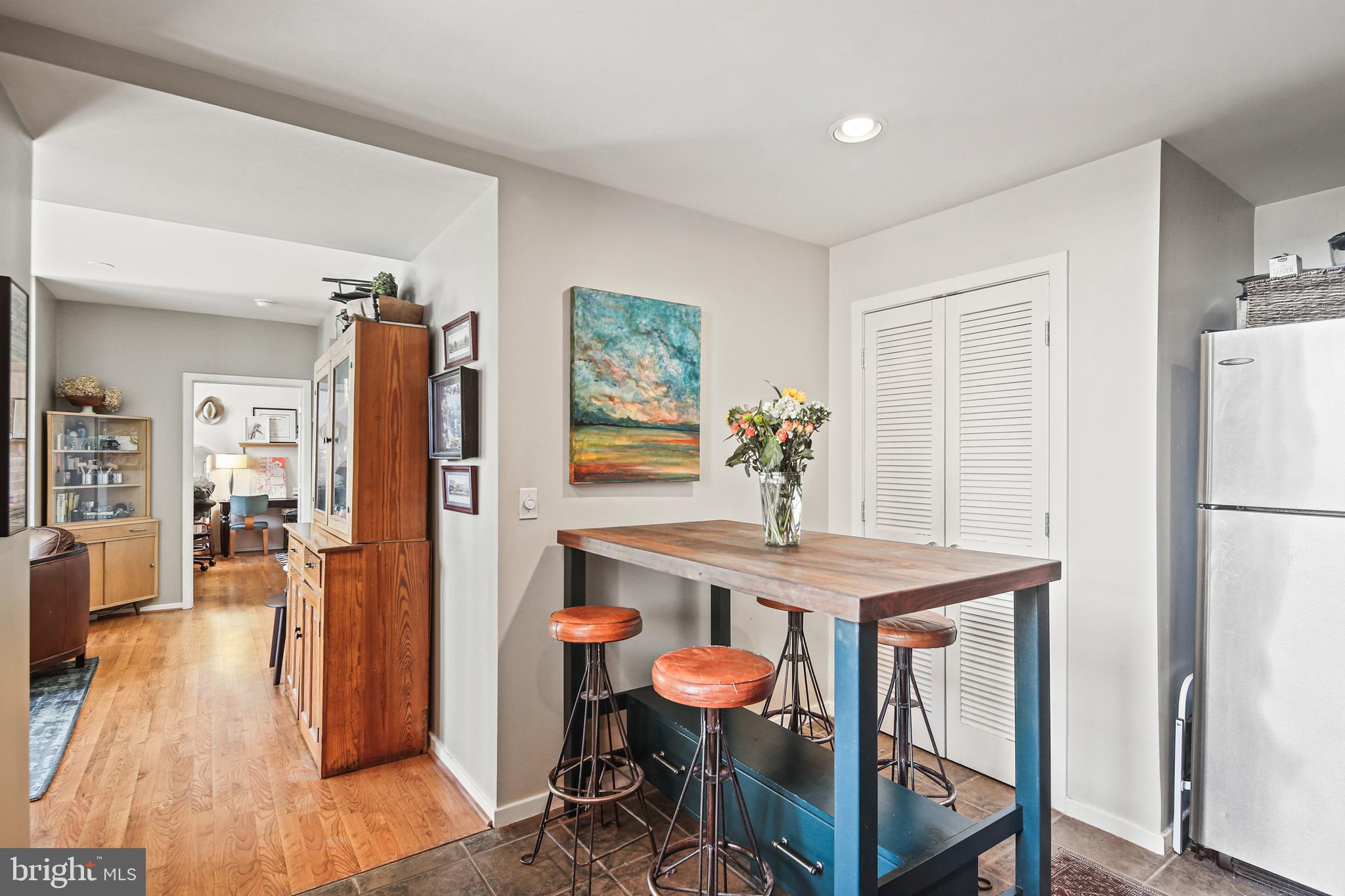 1211 Light Street, Unit 308 Baltimore, MD 21230 - Photo 10 of 29 a view of a dining room with furniture and wooden floor