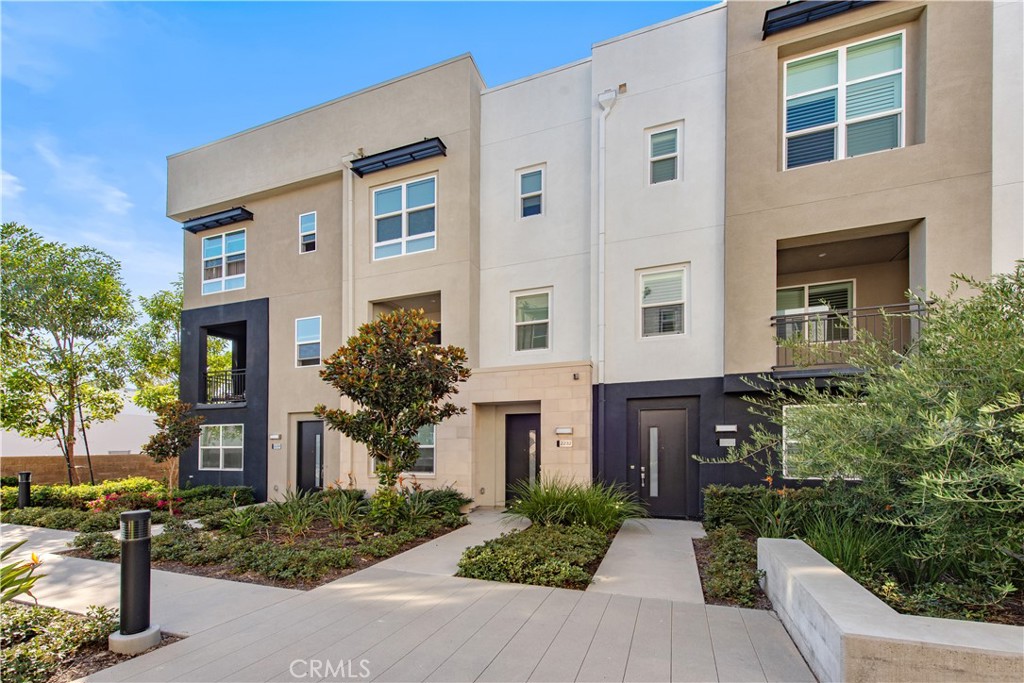 2232 Synergy Irvine, CA 92614 - Photo 1 of 1 front view of house with a yard