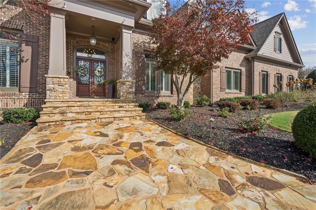 3030 Wills Mill Road Cumming, GA 30041 - Photo 16 of 71 a front view of a house with a yard