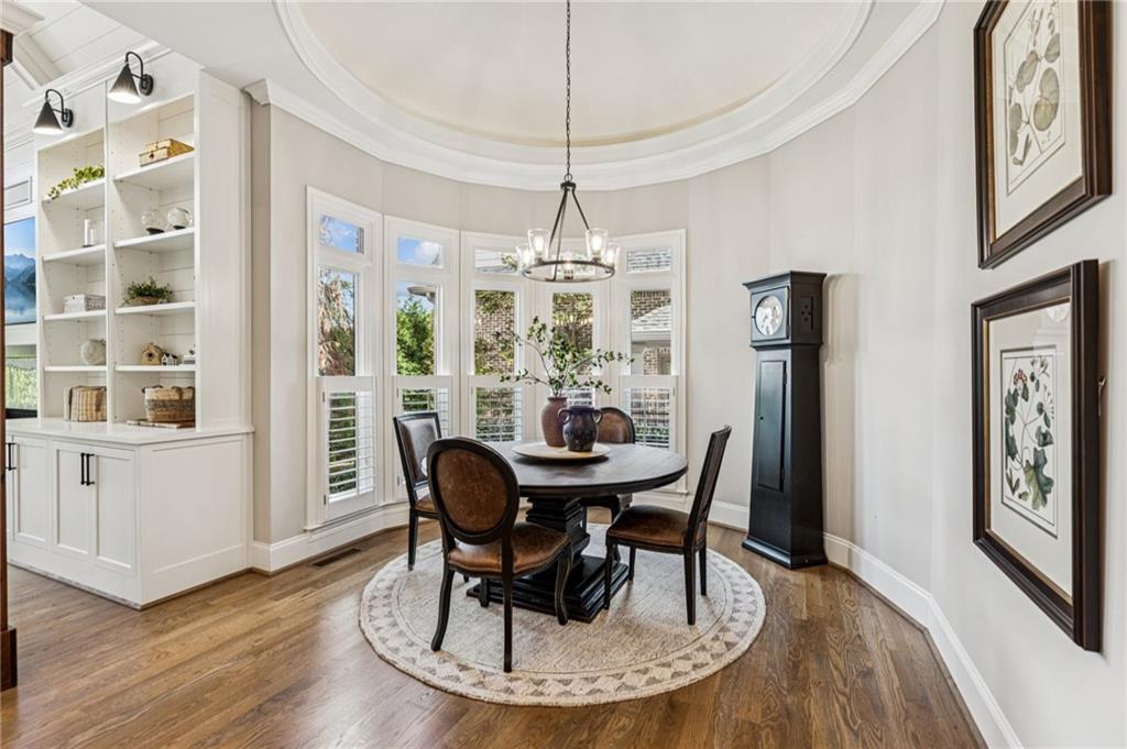 3030 Wills Mill Road Cumming, GA 30041 - Photo 26 of 71 a view of a dining room with furniture window and wooden floor