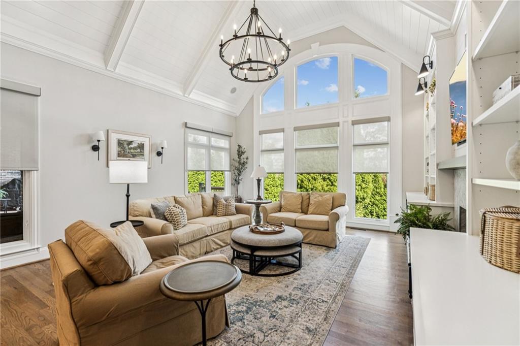 3030 Wills Mill Road Cumming, GA 30041 - Photo 28 of 71 a living room with fireplace furniture and a chandelier
