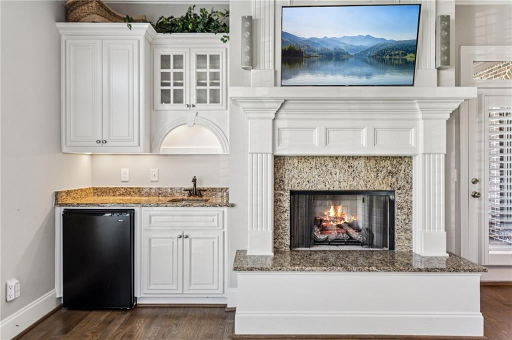3030 Wills Mill Road Cumming, GA 30041 - Photo 32 of 71 a living room with a fireplace and a fireplace
