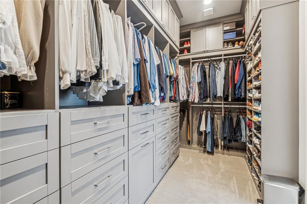 3030 Wills Mill Road Cumming, GA 30041 - Photo 35 of 71 a view of walk in closet with clothes and shoes