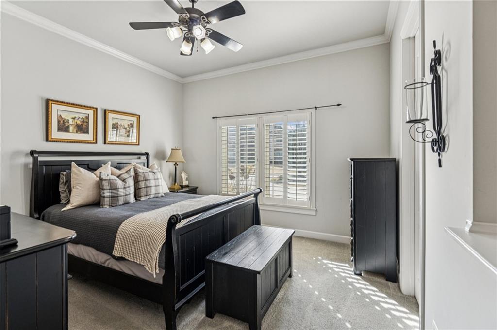 3030 Wills Mill Road Cumming, GA 30041 - Photo 36 of 71 a bedroom with a bed and a chandelier