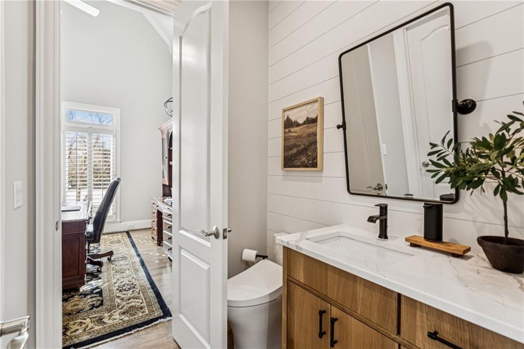 3030 Wills Mill Road Cumming, GA 30041 - Photo 40 of 71 a view of a bathroom with a sink and a mirror
