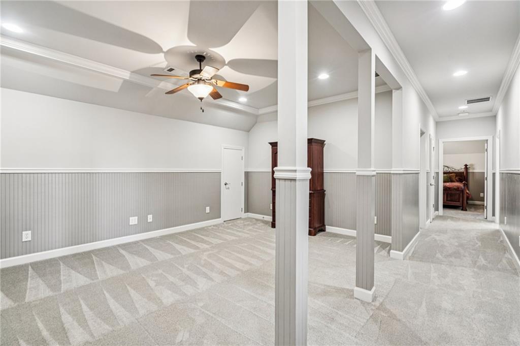 3030 Wills Mill Road Cumming, GA 30041 - Photo 43 of 71 a view of a kitchen with a refrigerator and a ceiling fan