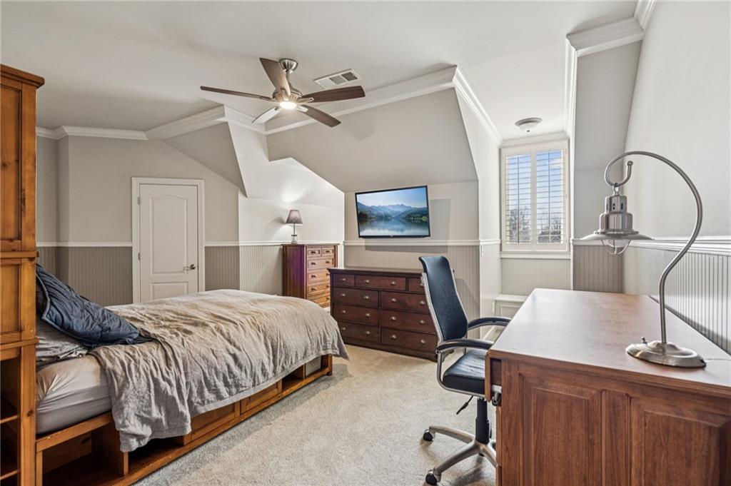 3030 Wills Mill Road Cumming, GA 30041 - Photo 44 of 71 a bedroom with a bed a flat screen tv and dresser