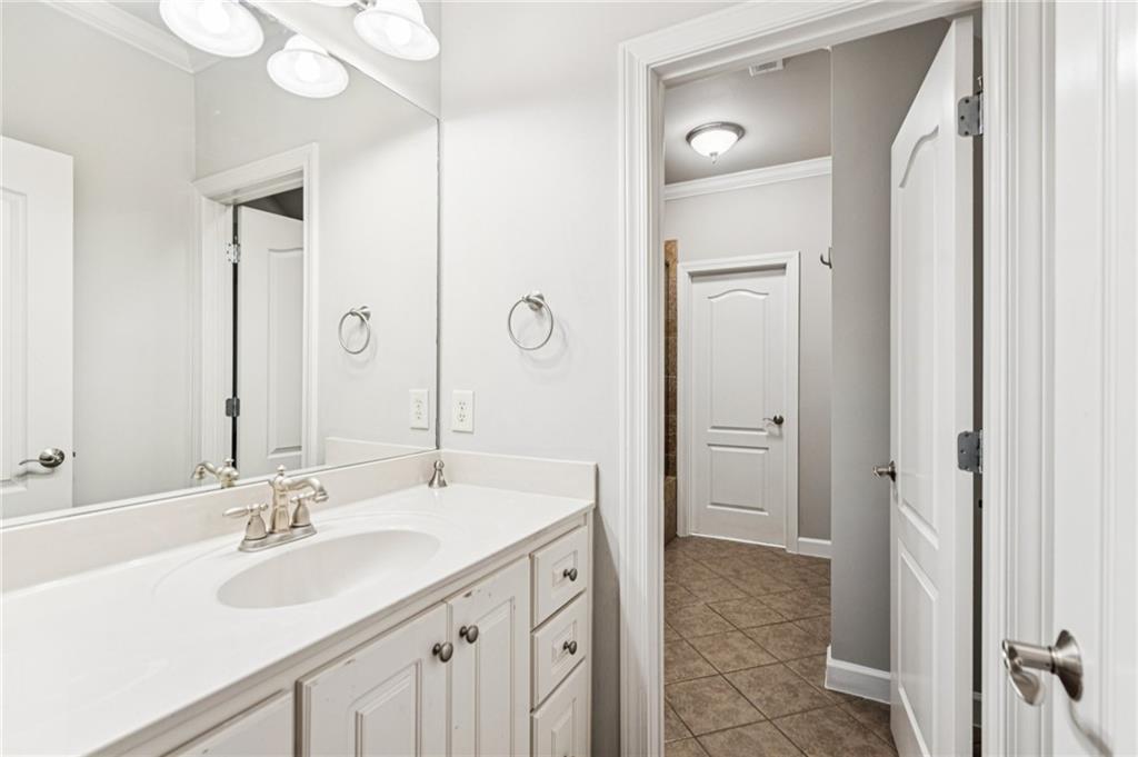 3030 Wills Mill Road Cumming, GA 30041 - Photo 46 of 71 a bathroom with a sink double vanity and a mirror