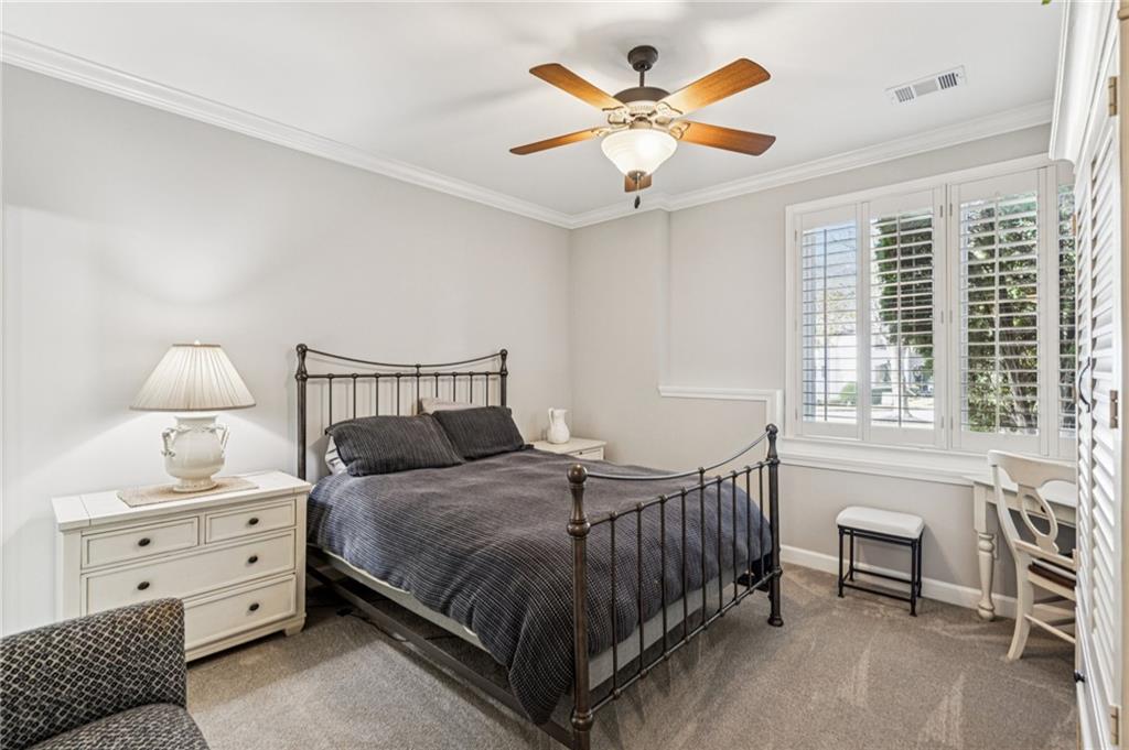 3030 Wills Mill Road Cumming, GA 30041 - Photo 53 of 71 a bedroom with a bed chandelier and a window