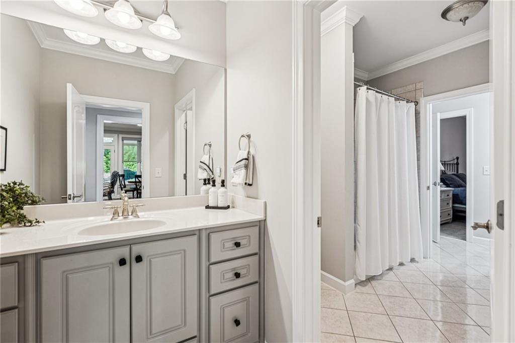 3030 Wills Mill Road Cumming, GA 30041 - Photo 54 of 71 a bathroom with a sink vanity and a mirror