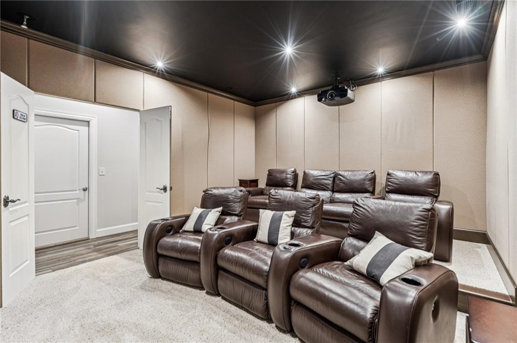 3030 Wills Mill Road Cumming, GA 30041 - Photo 55 of 71 a media room with lots of chairs and a projector