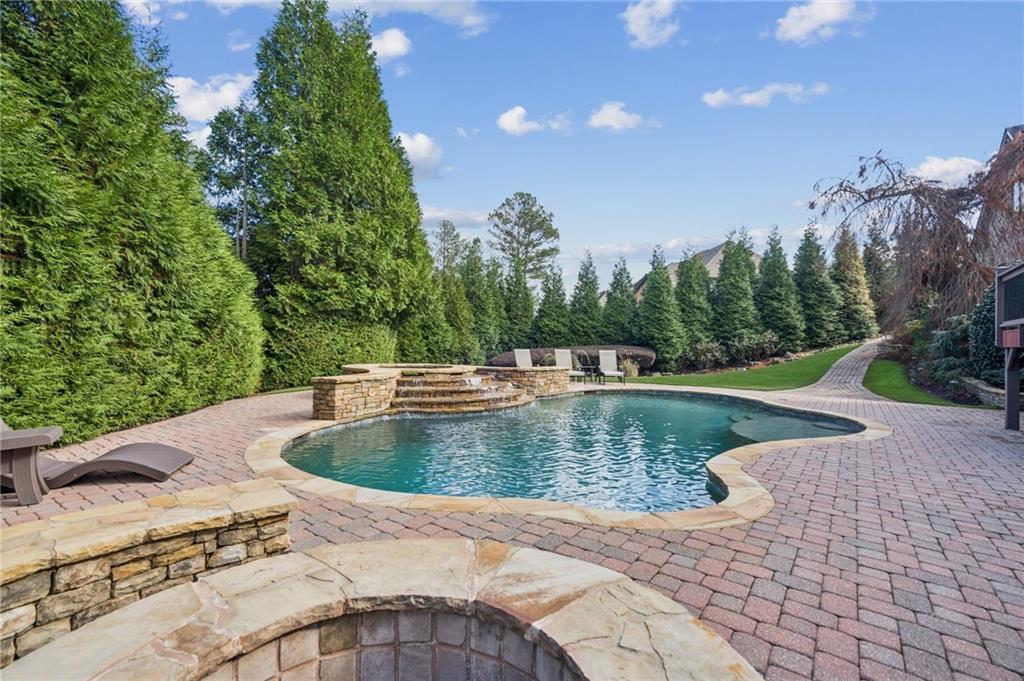 3030 Wills Mill Road Cumming, GA 30041 - Photo 61 of 71 a view of a water fountain in the backyard