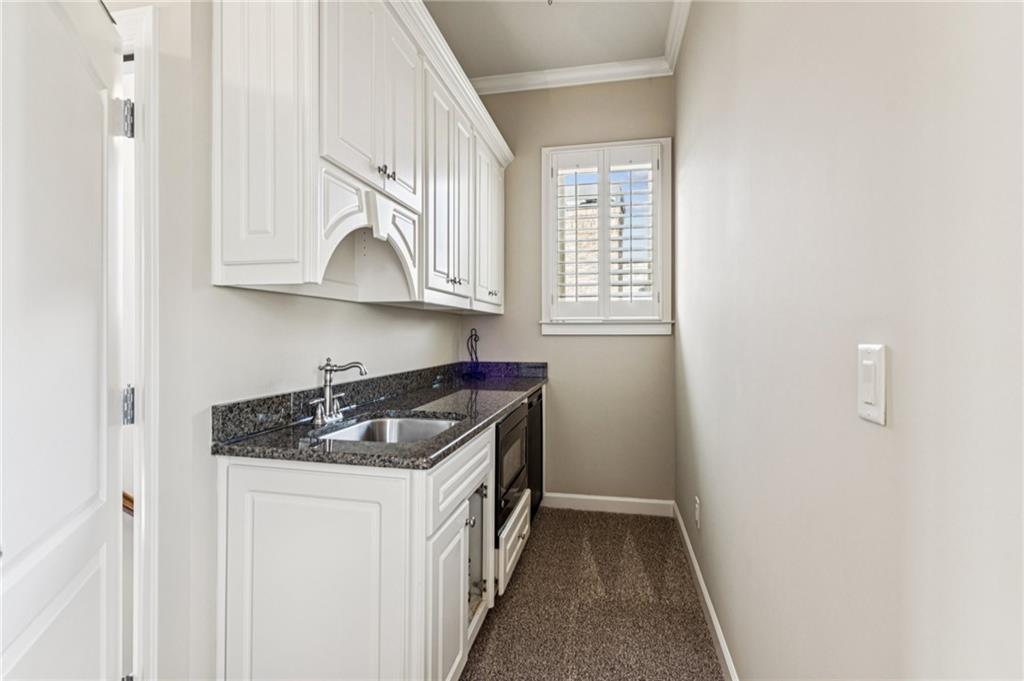 3030 Wills Mill Road Cumming, GA 30041 - Photo 66 of 71 a kitchen with granite countertop a sink stove and cabinets