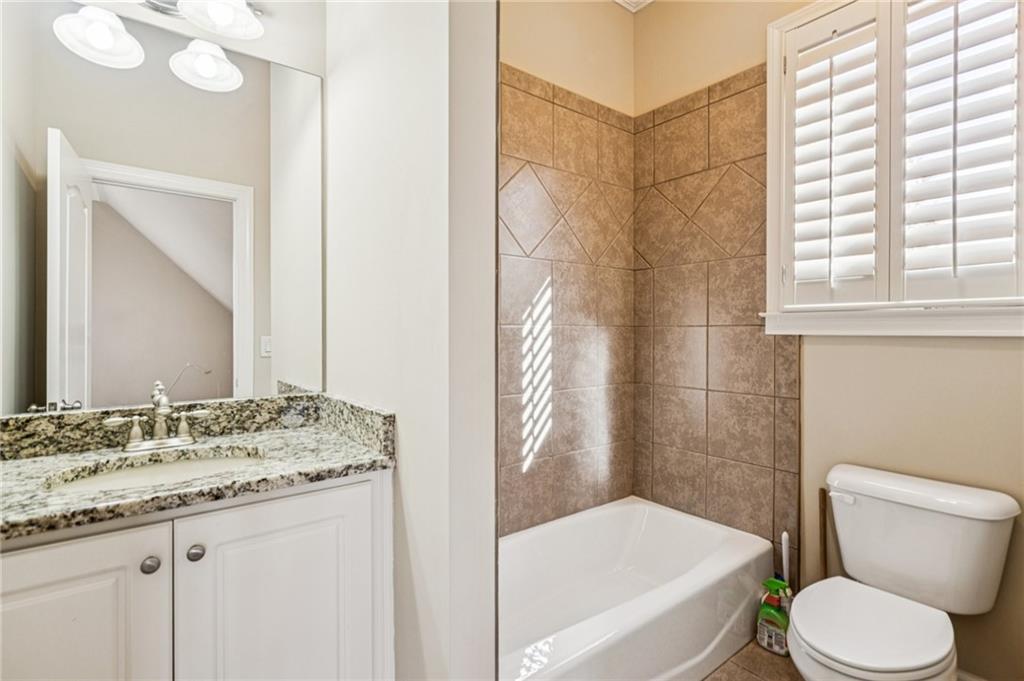 3030 Wills Mill Road Cumming, GA 30041 - Photo 67 of 71 a bathroom with a granite countertop sink toilet and shower