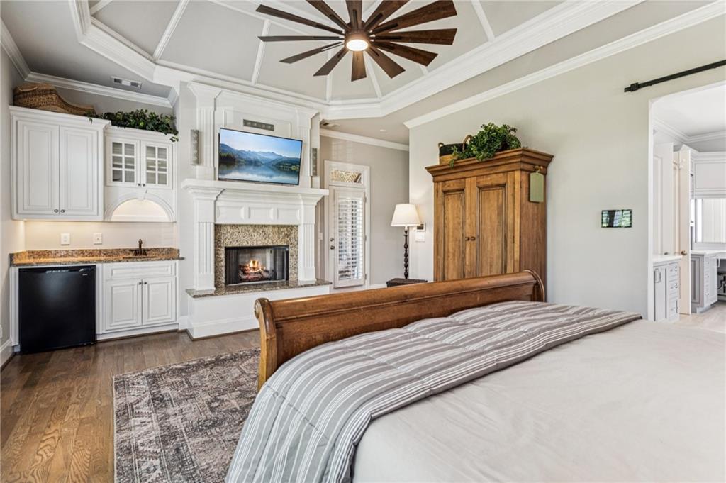 3030 Wills Mill Road Cumming, GA 30041 - Photo 8 of 71 a bedroom with a bed and a fireplace