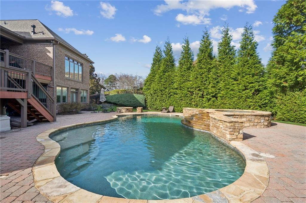 3030 Wills Mill Road Cumming, GA 30041 - Photo 10 of 71 a view of a swimming pool with a sitting space