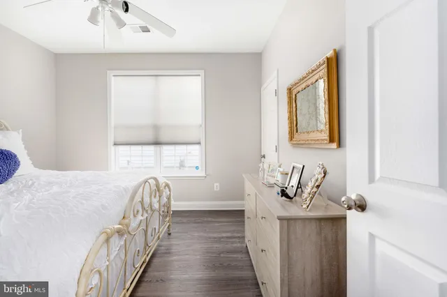 a bedroom with bed and a window