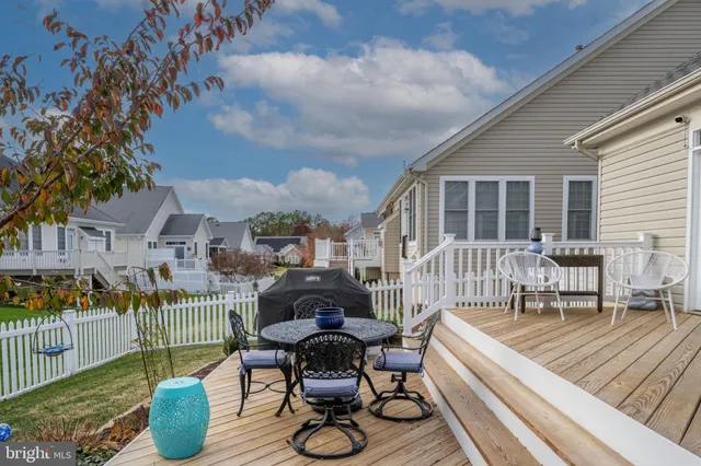 a view of a patio with couches chairs and a potted plant
