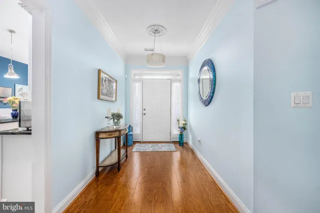 a view of hallway with wooden floor
