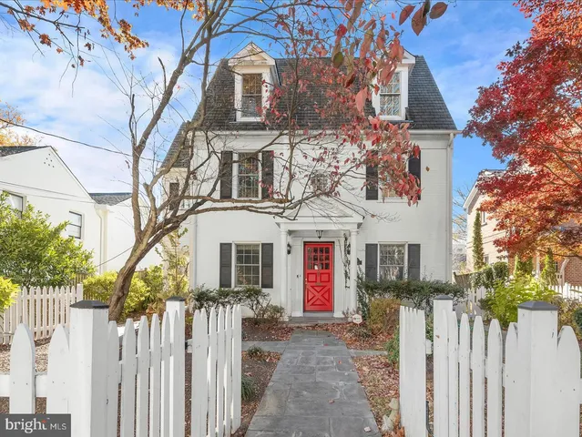 a front view of a house with a small yard