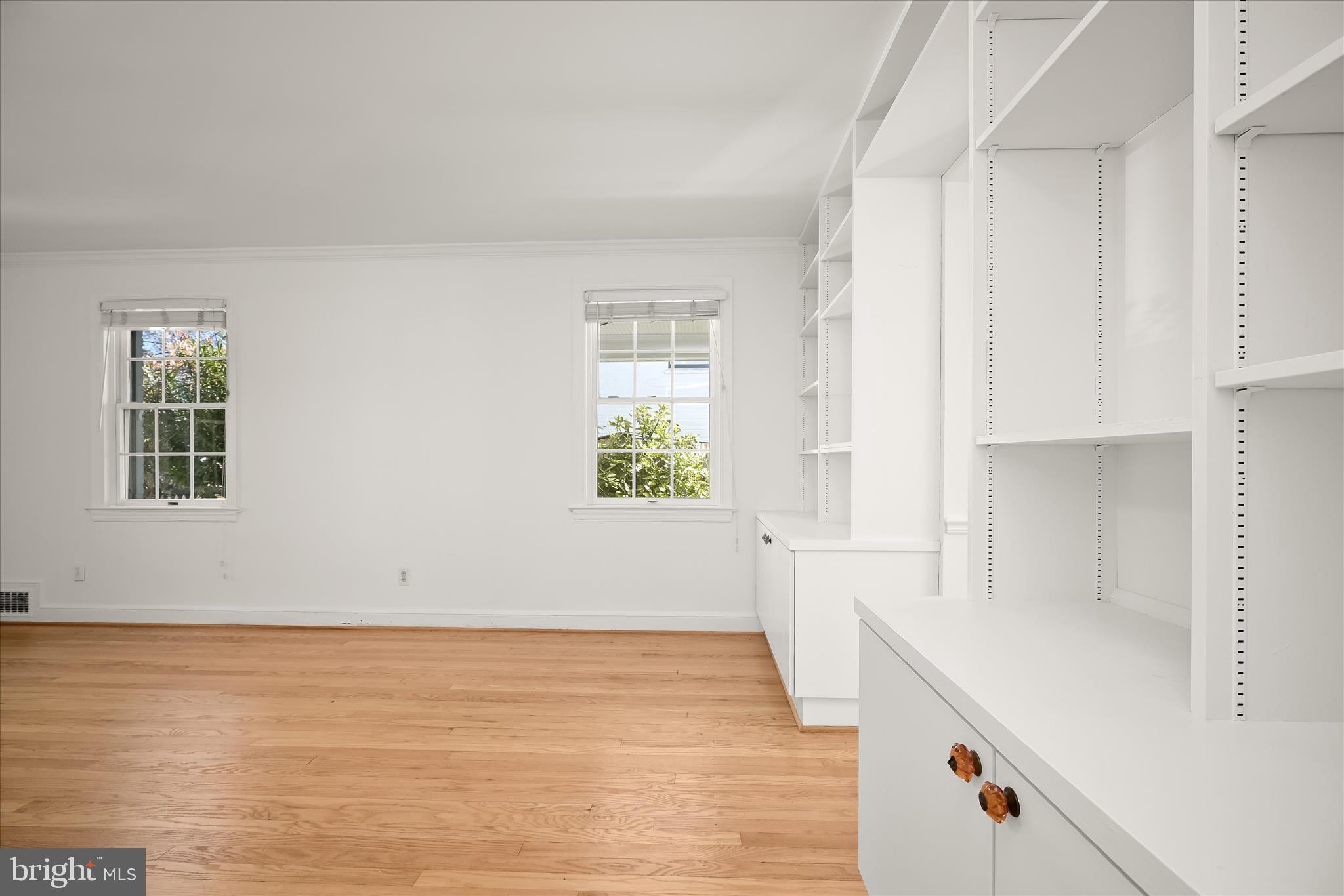 7012 Exeter Road Bethesda, MD 20814 - Photo 17 of 103 a view of an empty room with wooden floor and a window