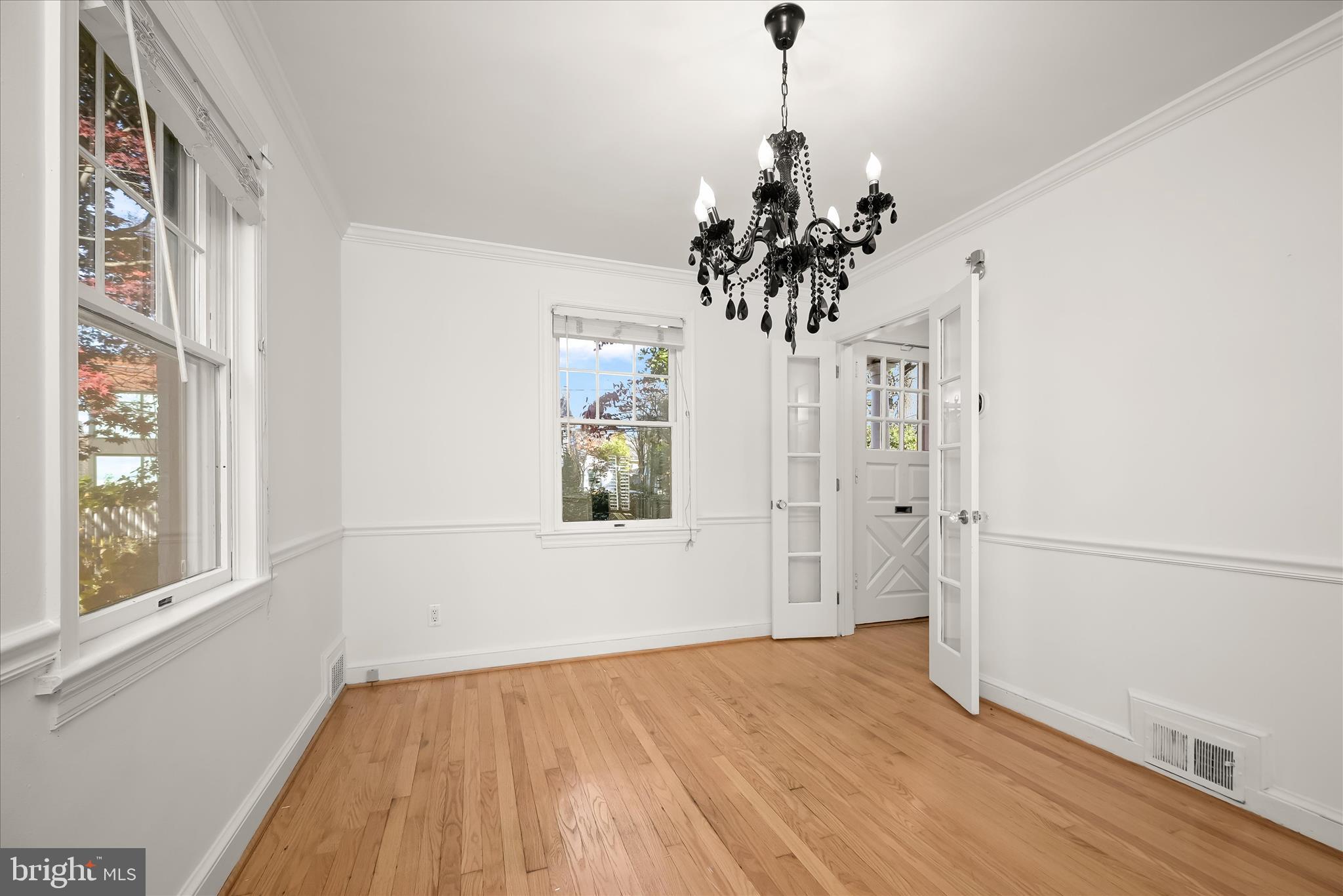 7012 Exeter Road Bethesda, MD 20814 - Photo 20 of 103 a view of a room with wooden floor and windows