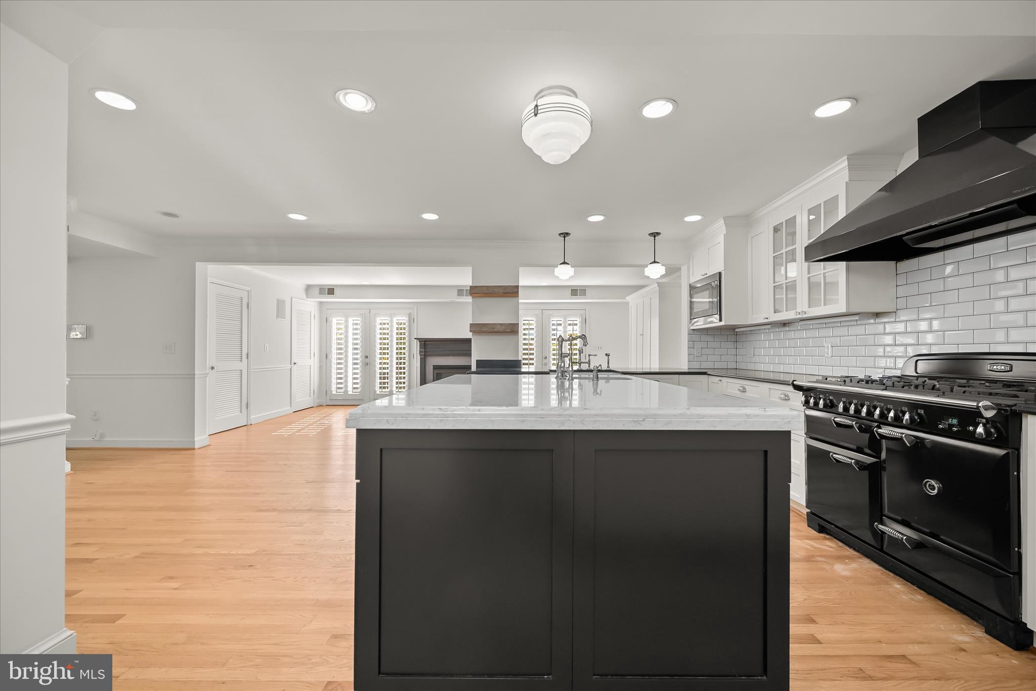 7012 Exeter Road Bethesda, MD 20814 - Photo 24 of 103 a kitchen with stainless steel appliances granite countertop a sink stove and refrigerator