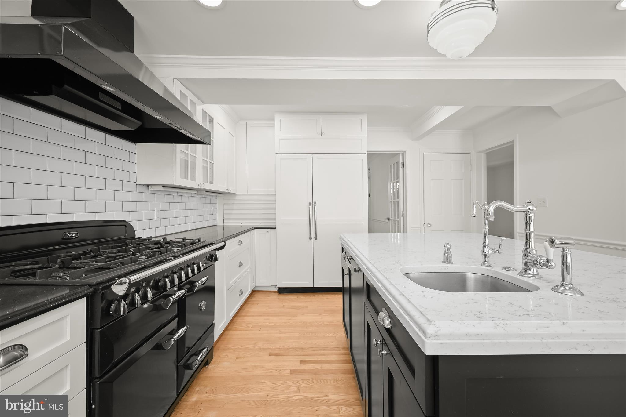 7012 Exeter Road Bethesda, MD 20814 - Photo 31 of 103 a kitchen with stainless steel appliances granite countertop a sink stove and cabinets