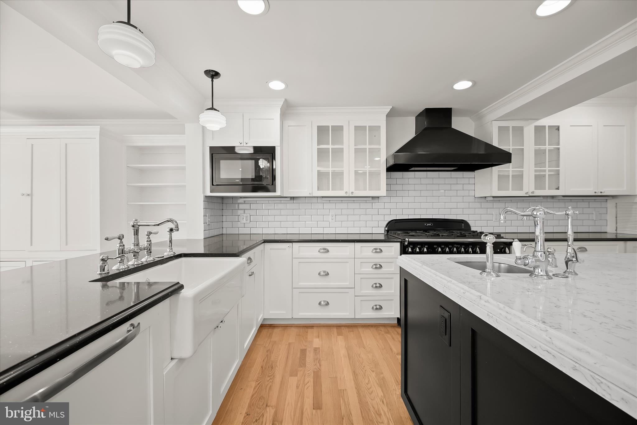 7012 Exeter Road Bethesda, MD 20814 - Photo 33 of 103 a kitchen with stainless steel appliances a sink stove and cabinets