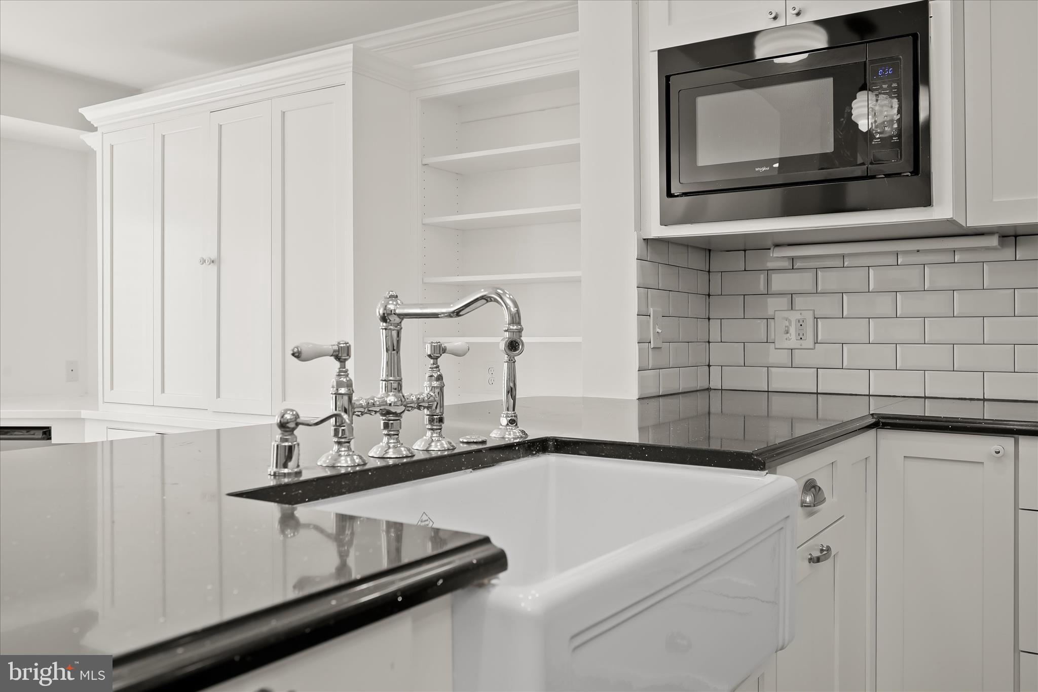 7012 Exeter Road Bethesda, MD 20814 - Photo 34 of 103 a bathroom with a sink and a mirror