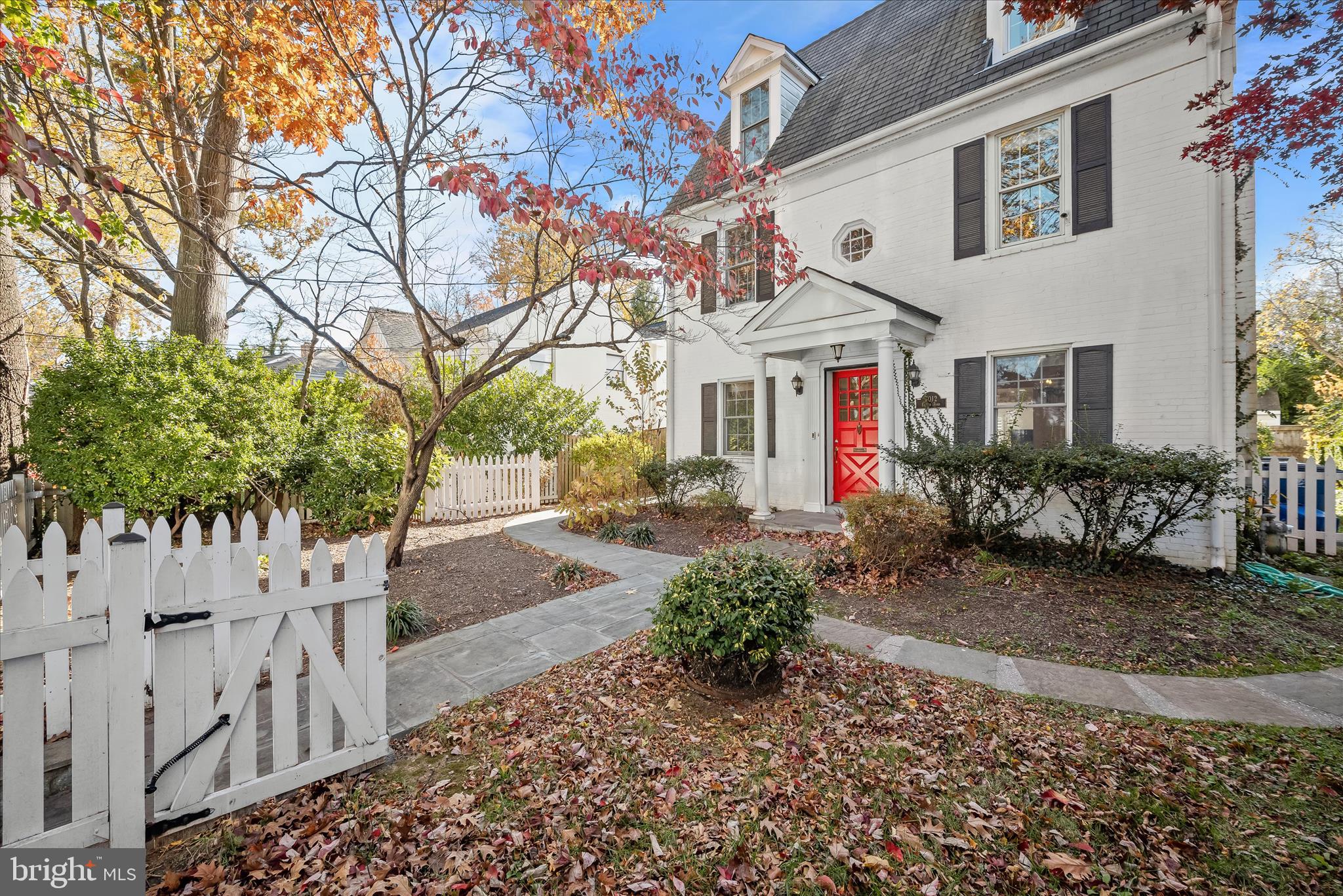 7012 Exeter Road Bethesda, MD 20814 - Photo 4 of 103 a front view of a house with a yard and garden