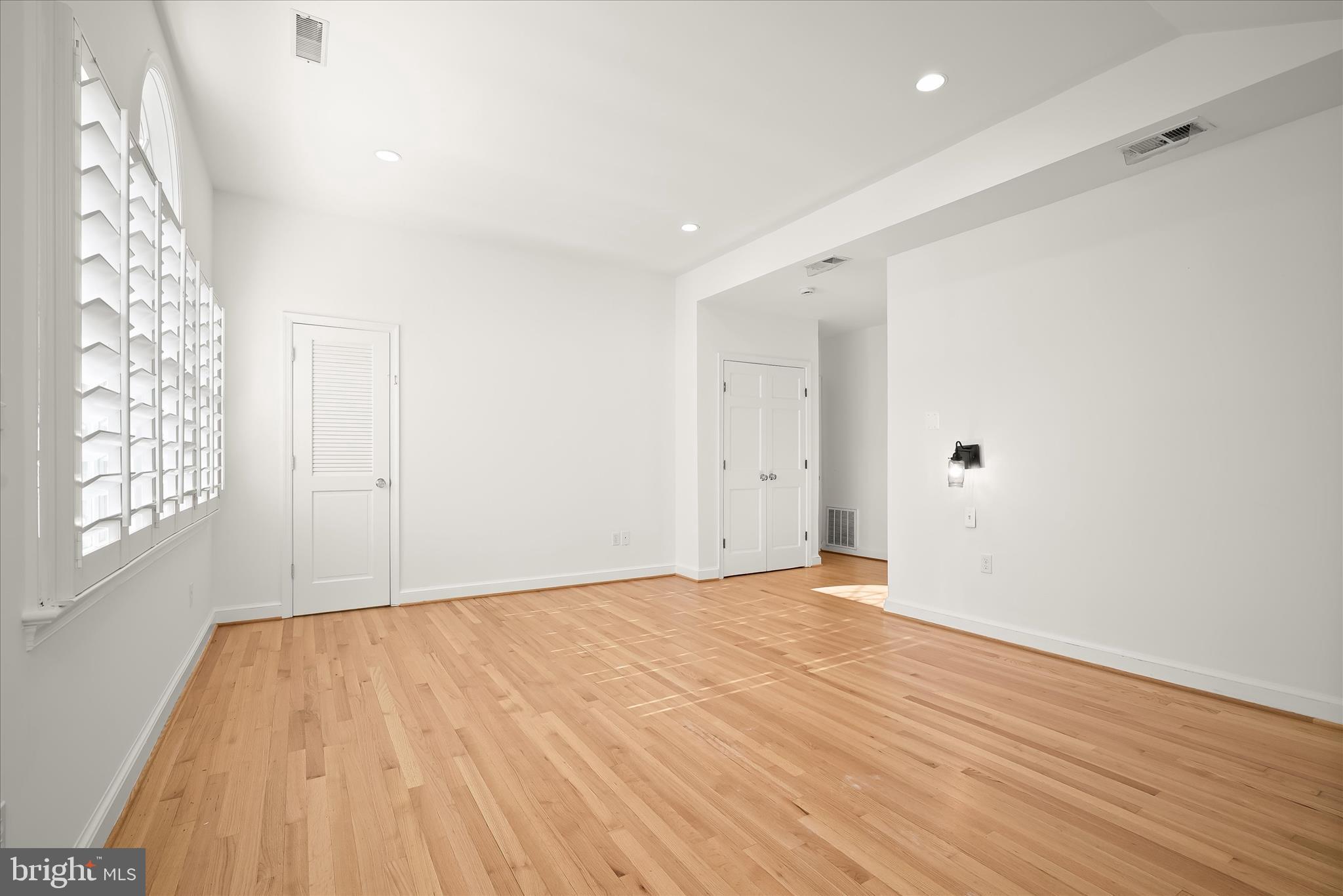 7012 Exeter Road Bethesda, MD 20814 - Photo 64 of 103 a view of empty room with wooden floor and fan