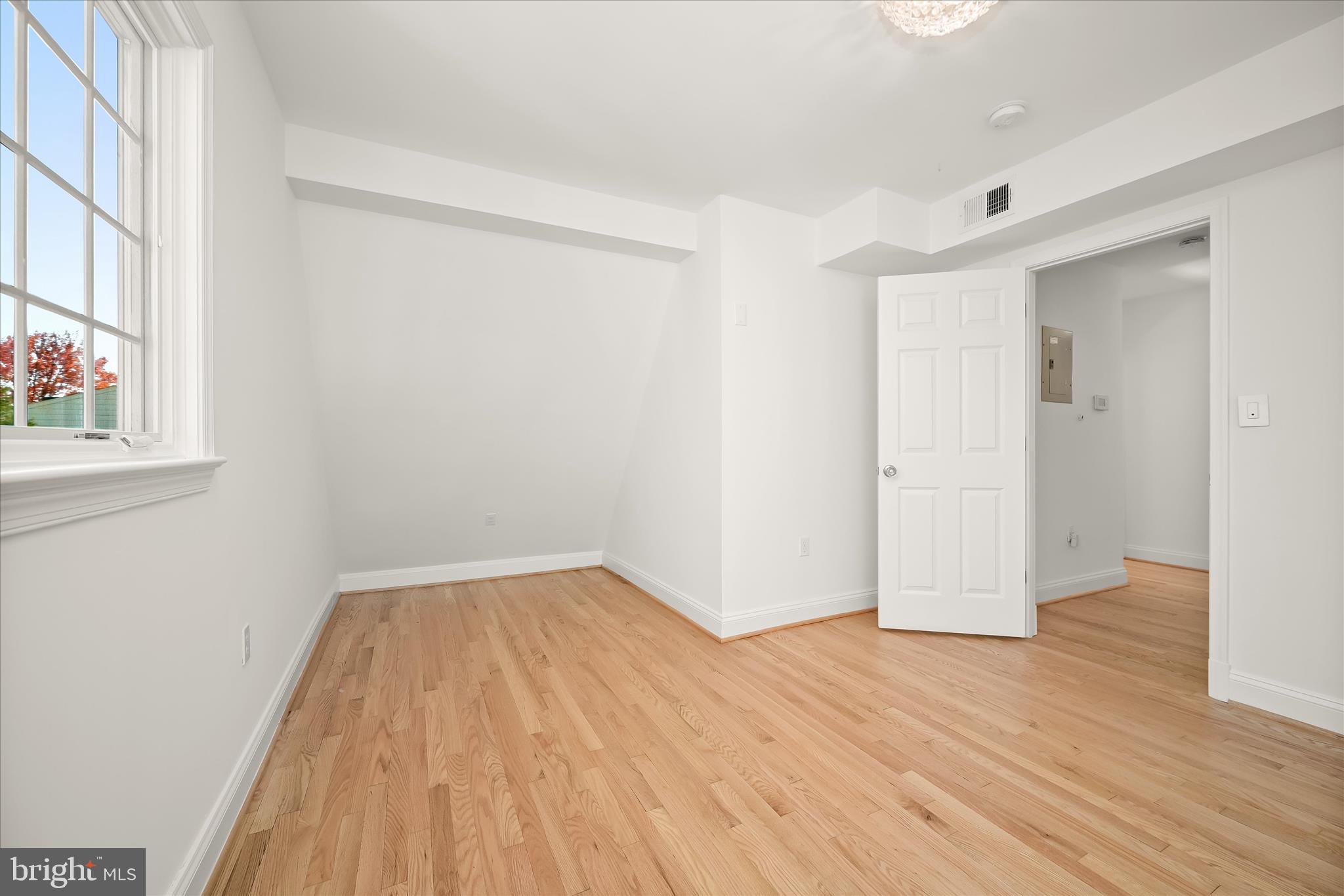 7012 Exeter Road Bethesda, MD 20814 - Photo 79 of 103 a view of a room with wooden floor and a window